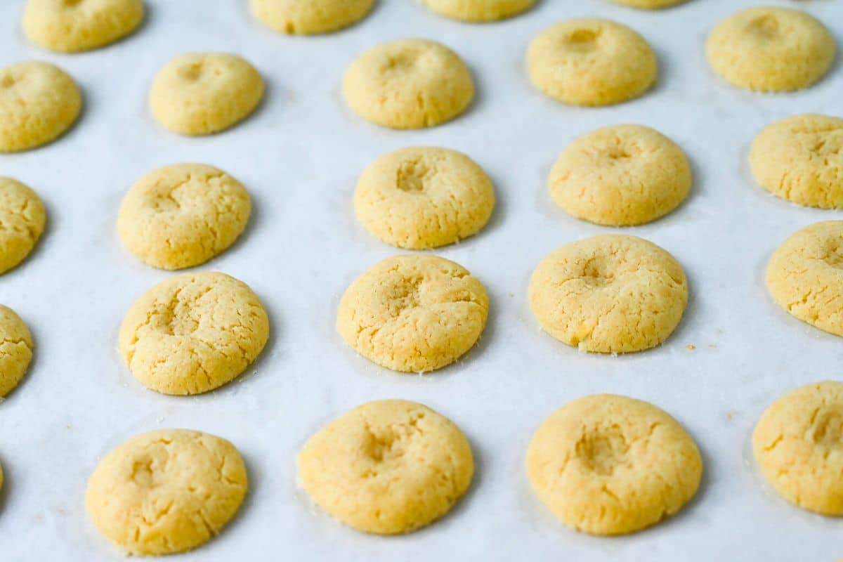 sugar cookies with a thumbprint pressed into the center