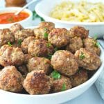 gluten free meatballs in a bowl sprinkled with fresh parsley