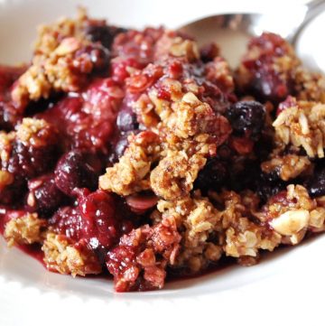 bowl of berry crumble with spoon