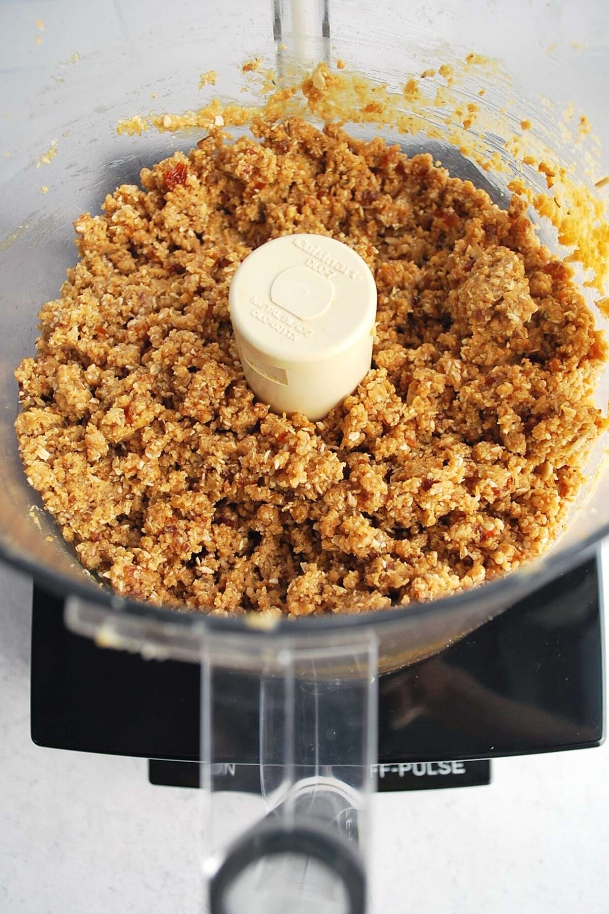 peanut butter protein ball ingredients blended in a food processor