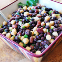 bowl of three bean salad with spoon