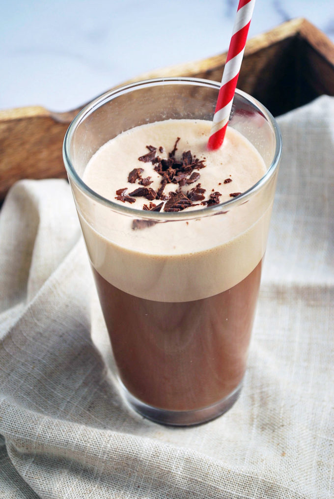 protein coffee made with chocolate Ovaltine and chocolate shavings on top