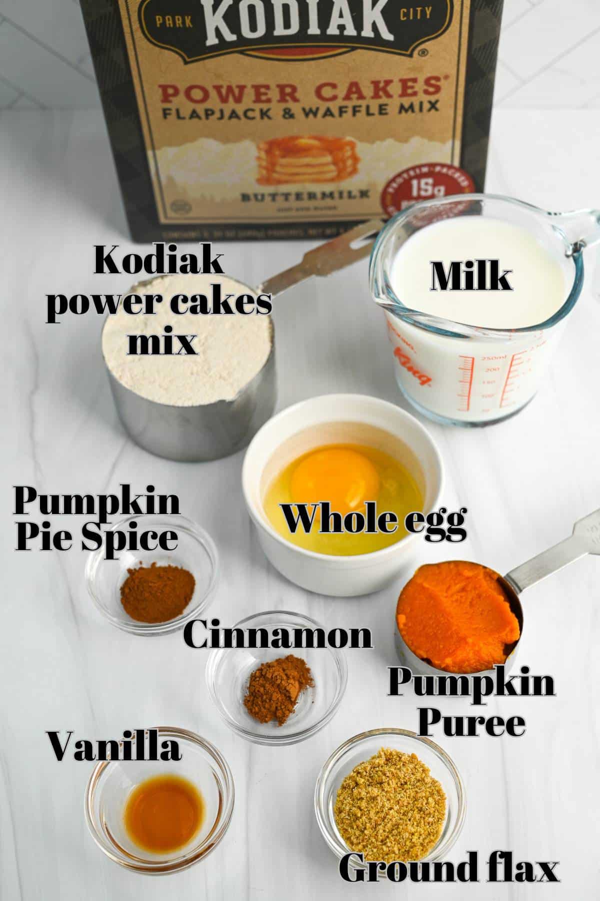 ingredients for protein pumpkin pancakes measured out on a counter
