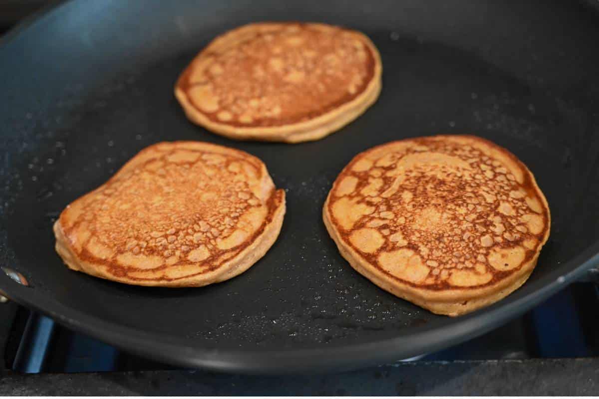 cooked pumpkin pancakes in a skillet