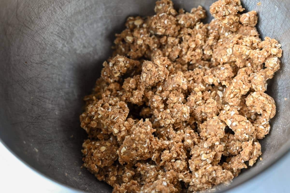 crumbled oat mixture in a mixing bowl