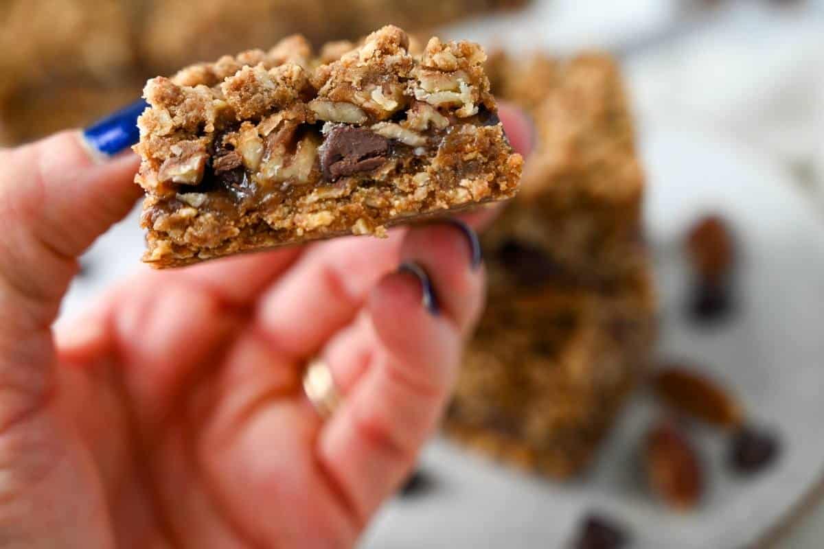 holding up a dessert bar slice