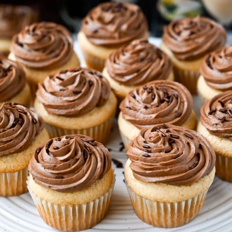 Baileys cupcakes with mocha frosting and chocolate sprinkles on a platter