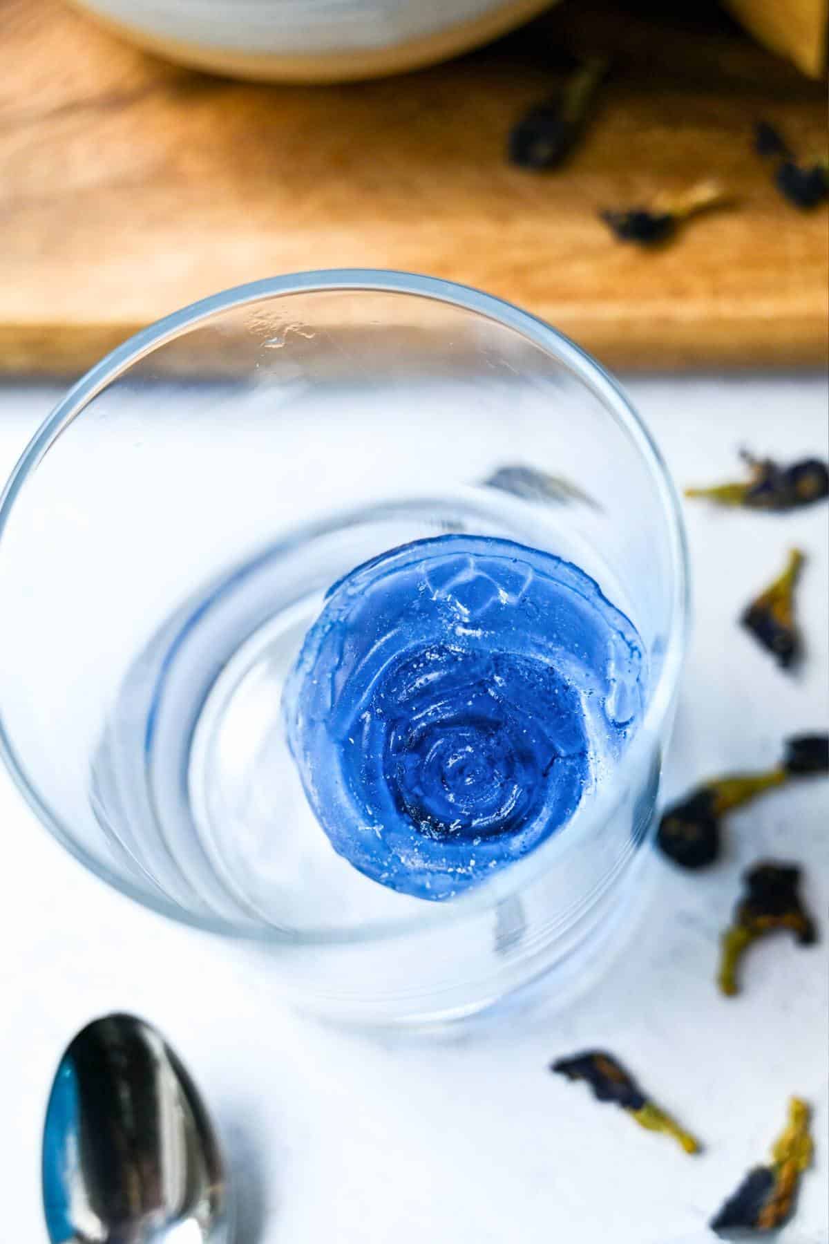 blue rose ice cube in a glass