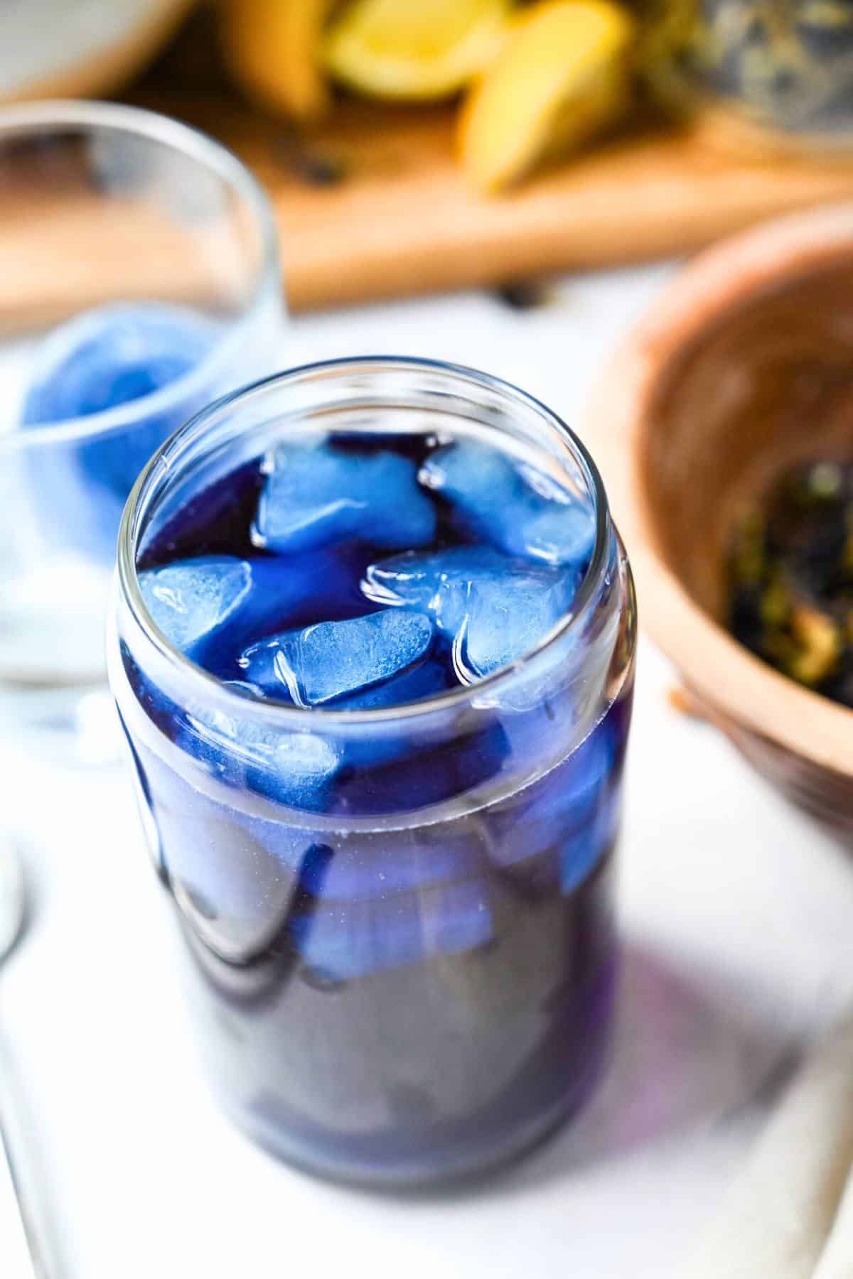 butterfly pea flower tea poured over ice
