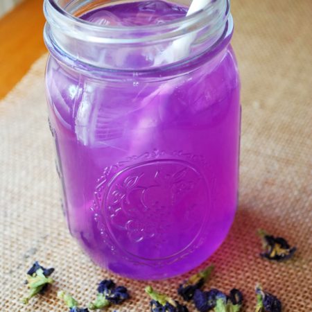 Blue chai lemonade in a mason jar