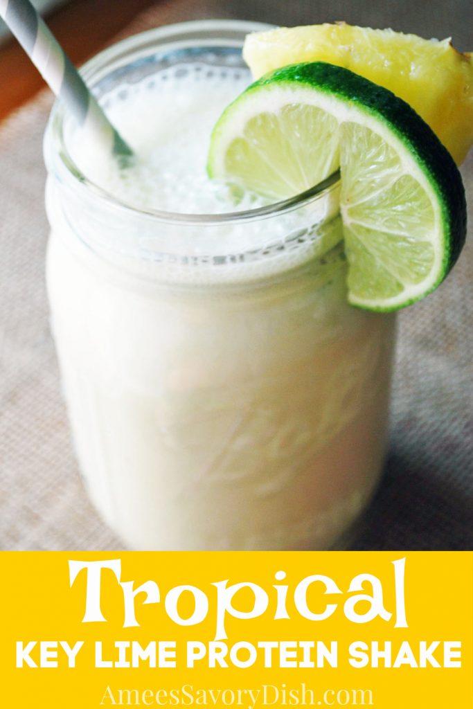 tropical smoothie in a glass with fruit slices and straw with font overlay