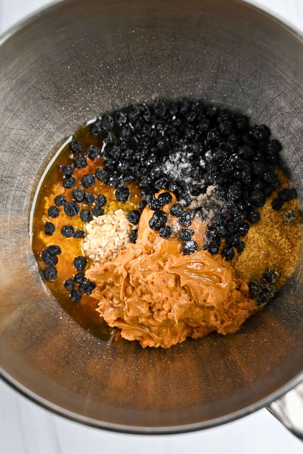 ingredients for energy balls in a stand mixer bowl