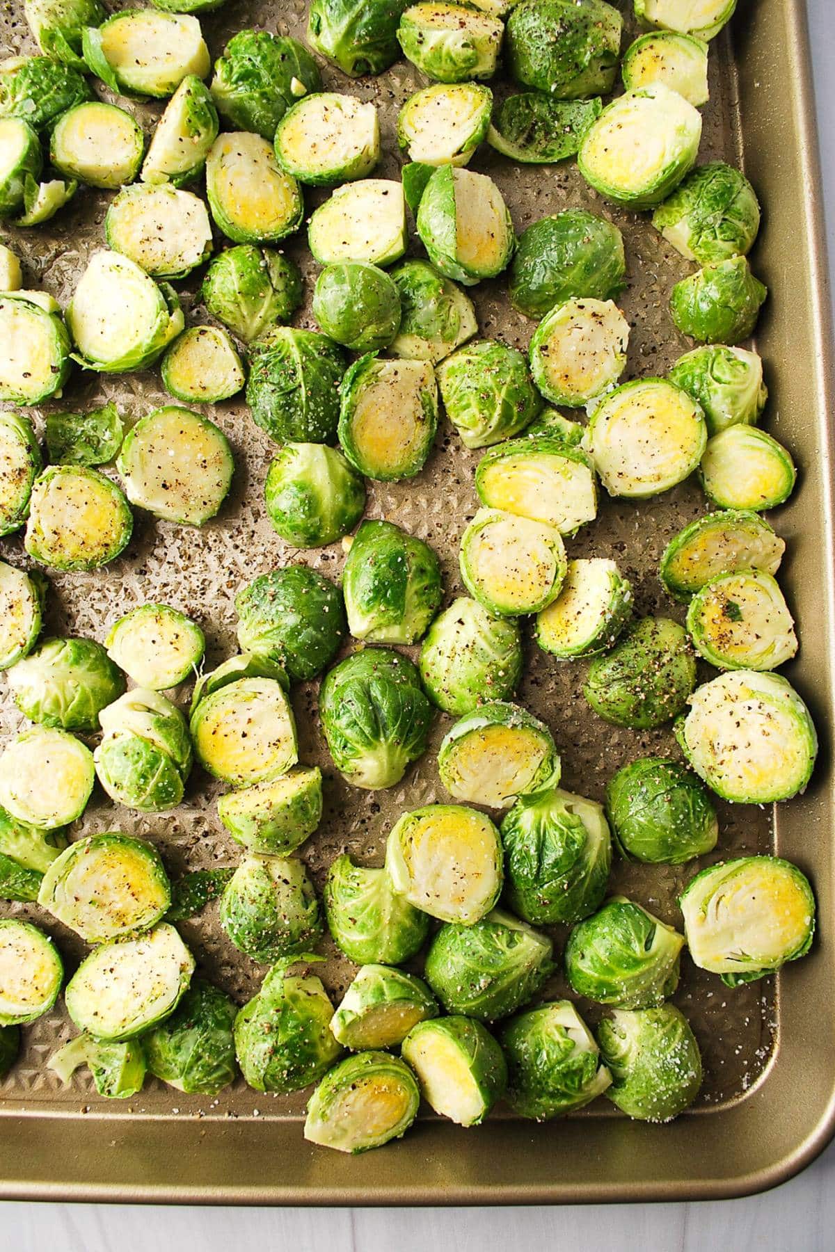 brussels sprouts spread onto a baking sheet
