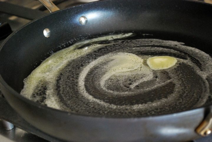 melted butter in pan for quiche filling