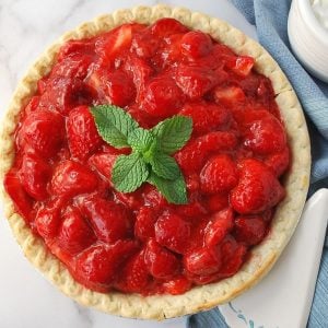 strawberry pie with a sprig of mint on top