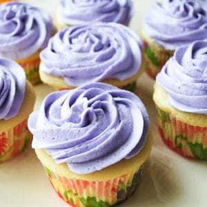 lavender cupcakes on a platter sprinkled with glitter sugar