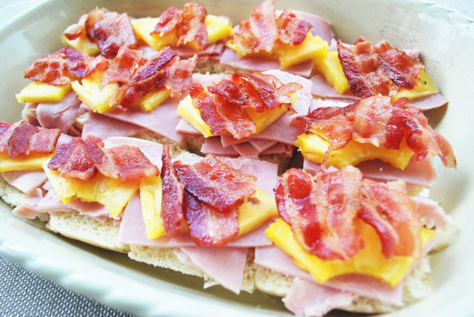 Hawaiian ham sliders are filled with teriyaki glazed ham, pineapple, bacon, and cheese.
