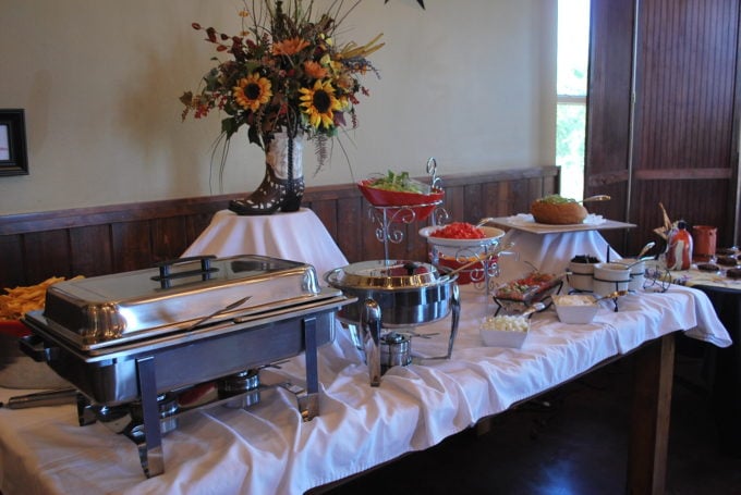 Buffet table with flowers and food