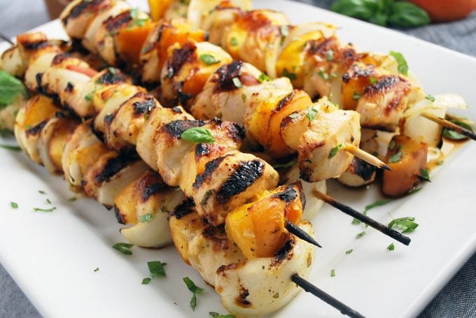 platter of grilled peach chicken kabobs