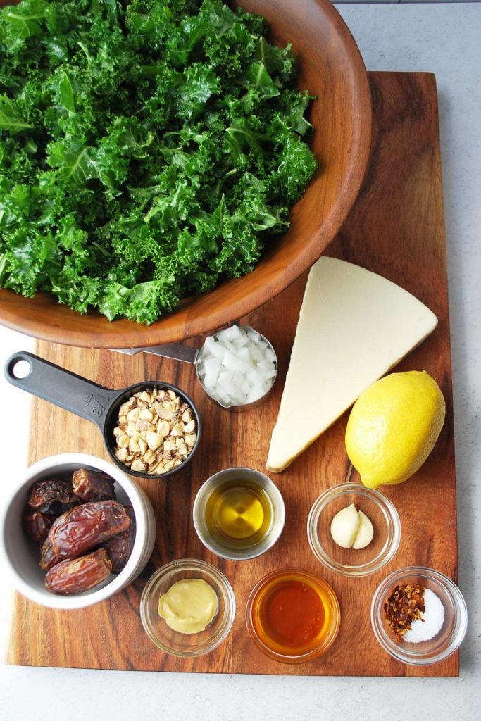 ingredients for kale crunch salad on a wood cutting board