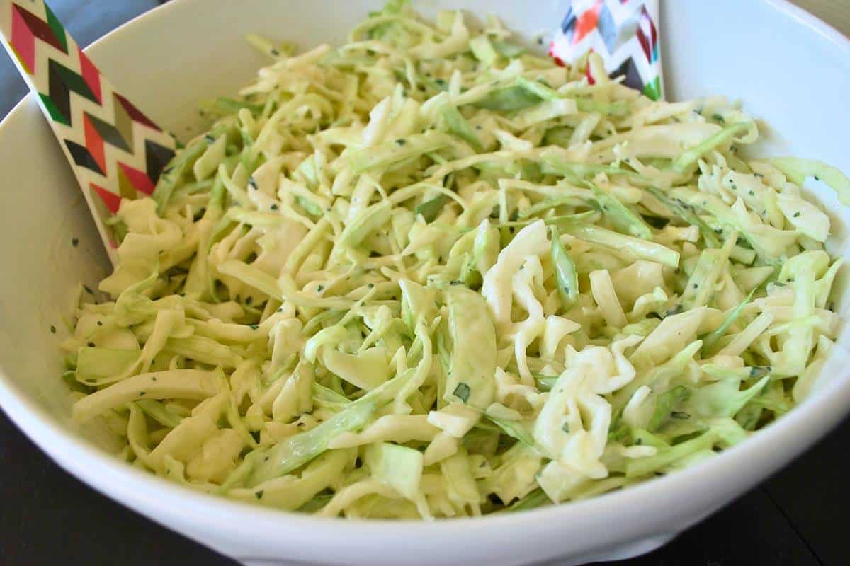 a bowl of slaw with cilantro and lime juice