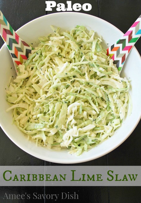 Coleslaw with colorful tongs in a white bowl