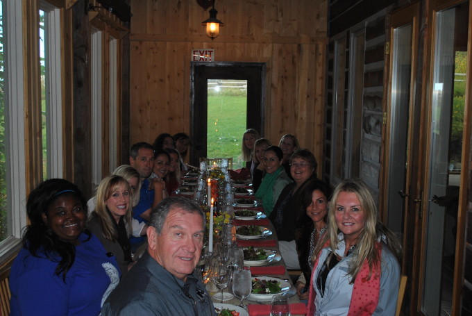 Group of bloggers and IPC employees sitting at a table posing for the camera