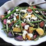 Roasted fingerling potato salad with green beans and feta cheese is a delicious and easy to make side salad recipe. Perfect for picnics or potlucks, it comes together in a snap!
