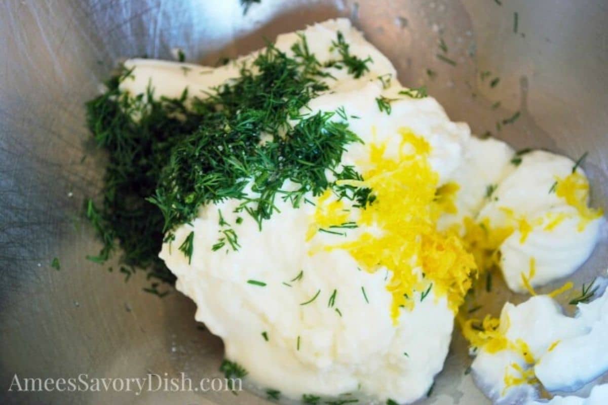 fresh yogurt lemon dill sauce in a bowl for salmon bites