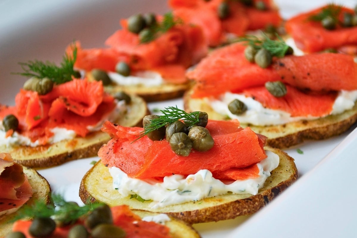 salmon bites on a white platter