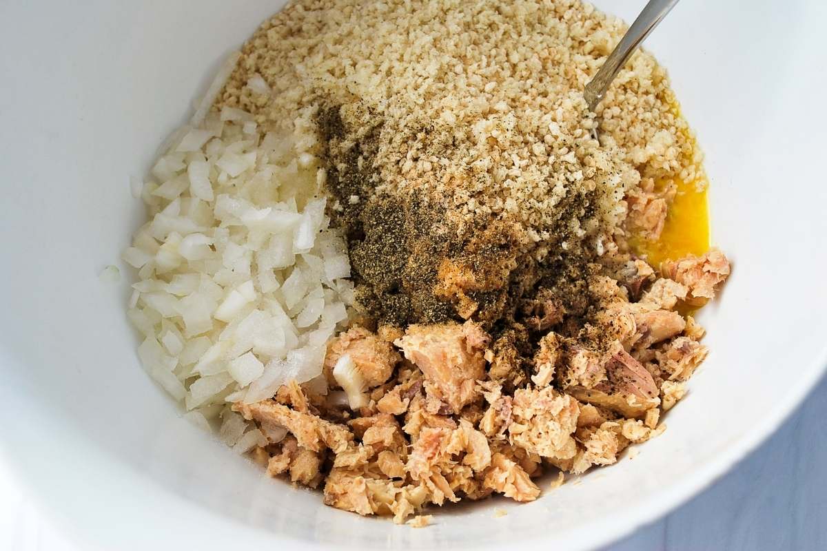 salmon patty ingredients in a white bowl