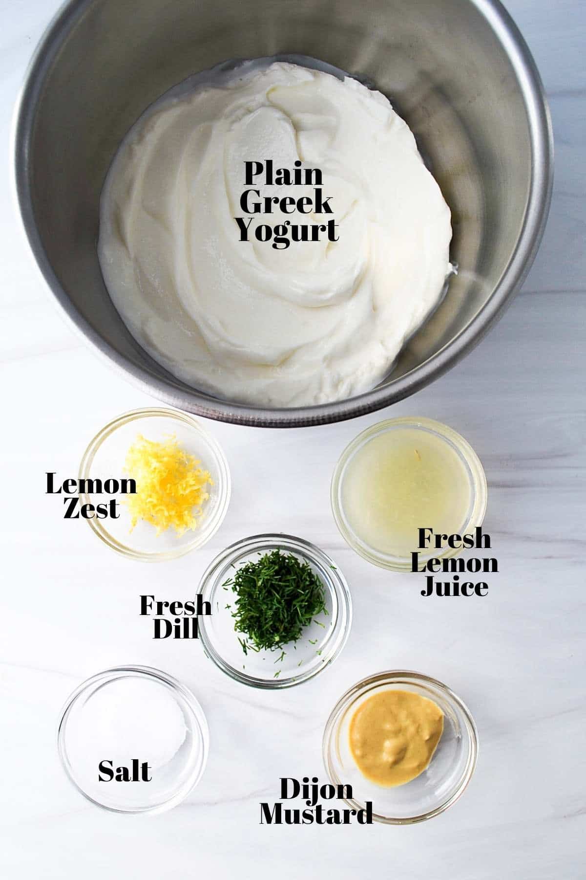 ingredients for yogurt dill sauce on a counter