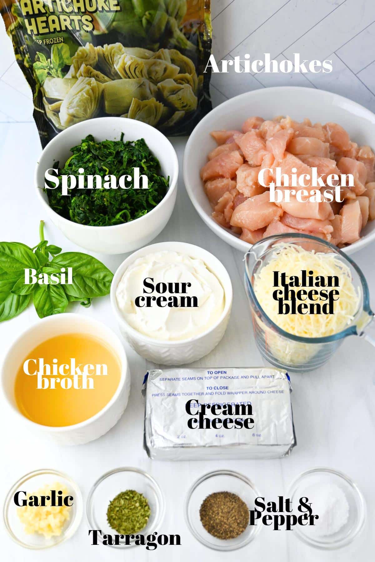 ingredients for spinach artichoke chicken measured out on a counter