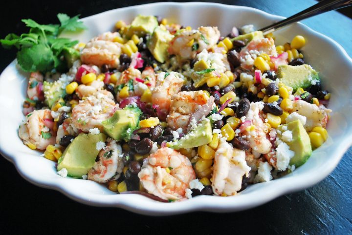 bowl of grilled shrimp salad prepared with spoon