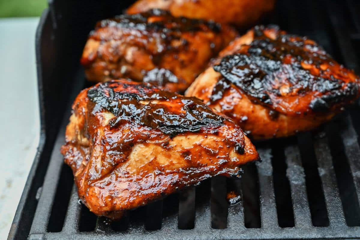 bbq bone in chicken breasts on a grill 