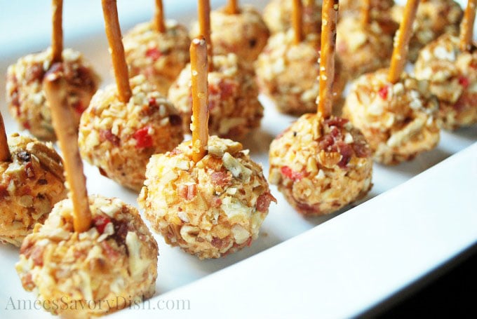 close up shot of spicy pimento cheese balls covered in bacon and nuts