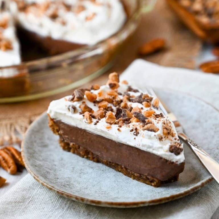 a slice of chocolate cream pie with toffee bits on top