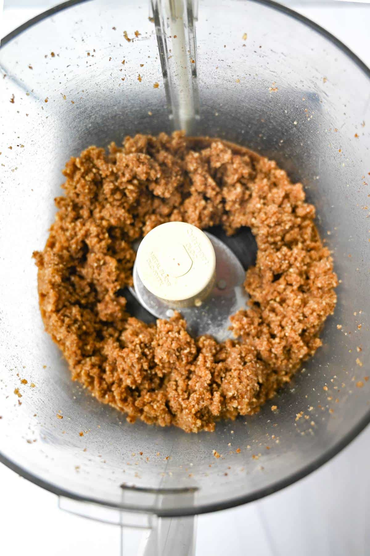 pecan pie crust mixture in a food processor