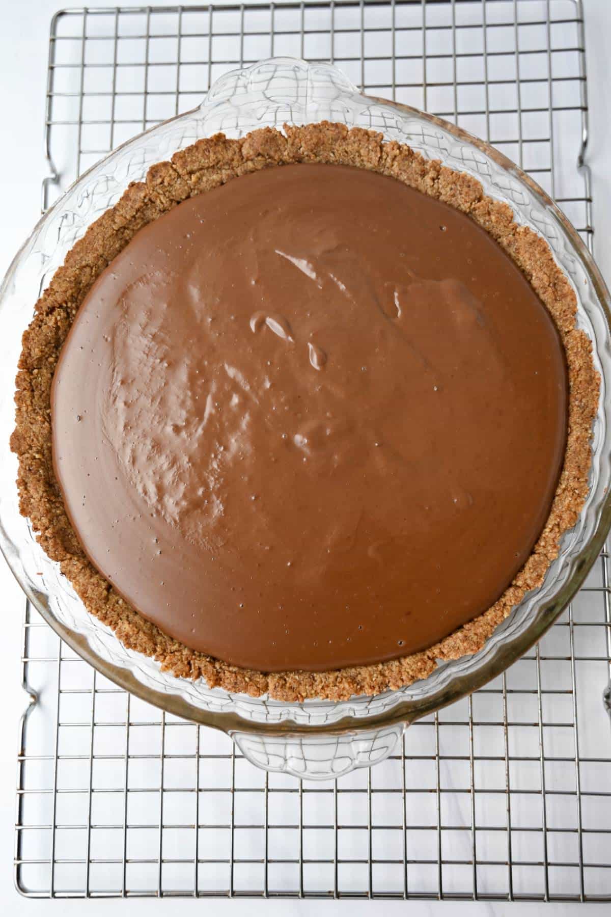 chocolate pie filling in a pecan pie shell