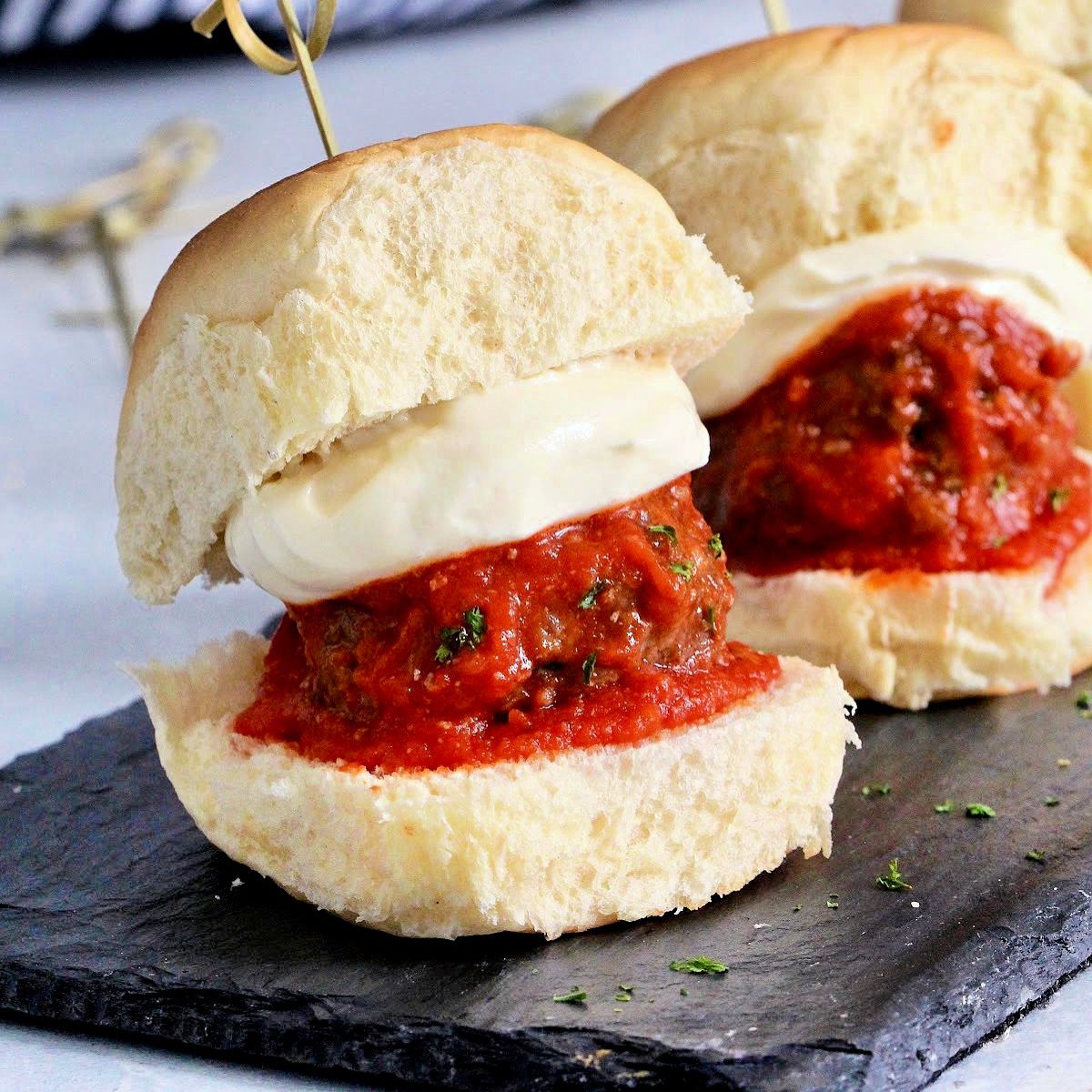 meatball sliders with a hunk of mozzarella