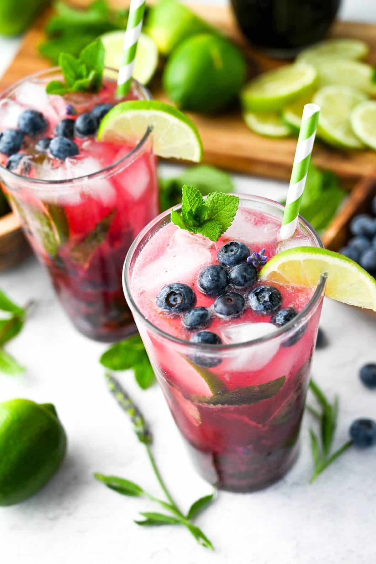 This Blueberry Lavender Mojito recipe makes the perfect summer cocktail made with blueberry lavender simple syrup, fresh lime, white rum, mint, and seasonal blueberries. via @Ameessavorydish