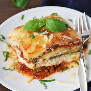zucchini lasagna on a white plate with fork