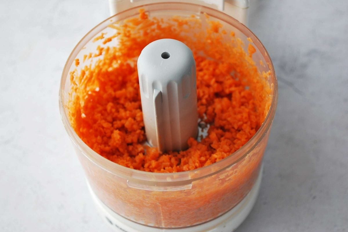 shredded carrots in a mini food processor