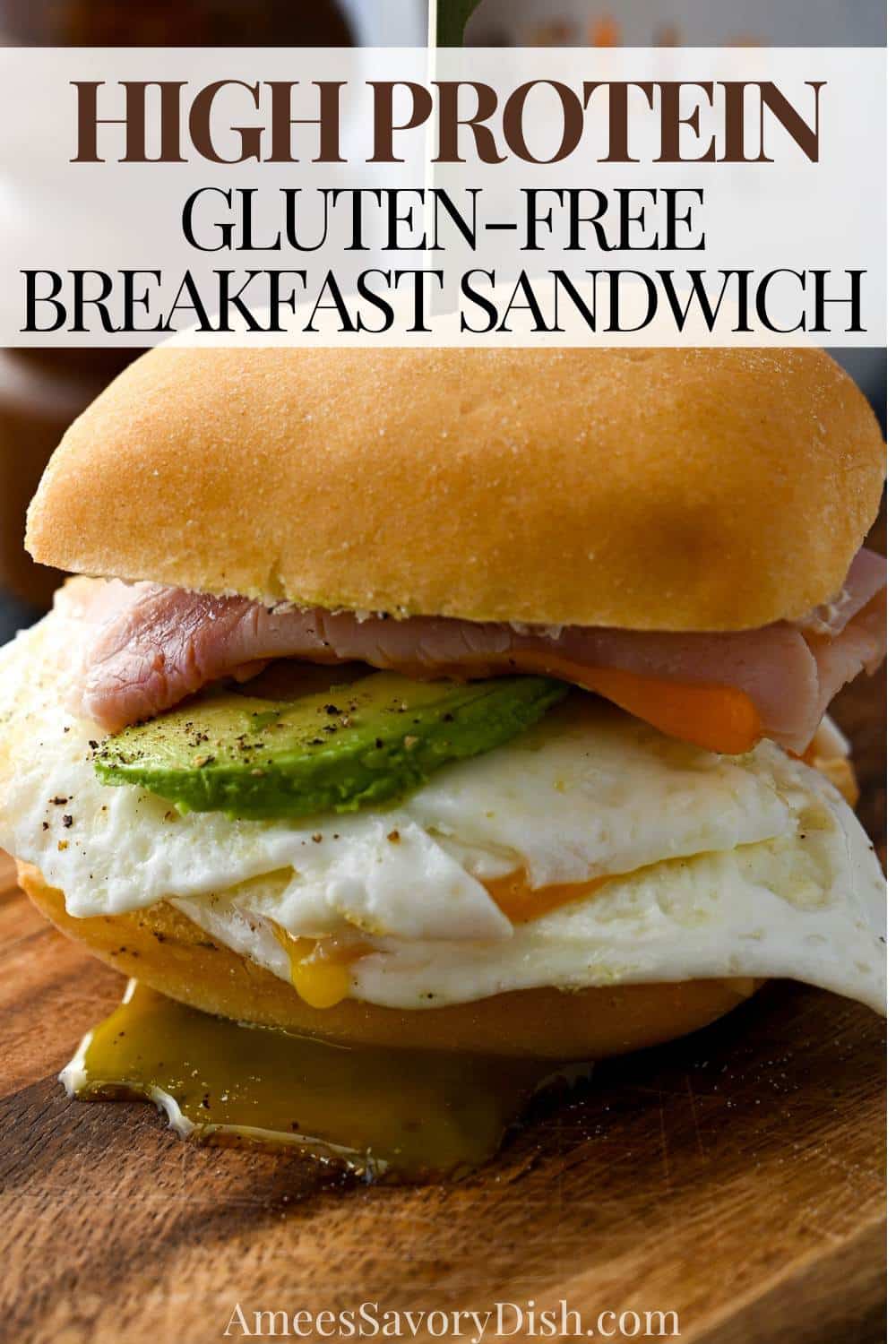A high-protein Gluten Free Breakfast Sandwich with fried egg, shaved ham, sharp cheddar, and avocado on a toasted gluten-free ciabatta roll. via @Ameessavorydish