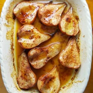 looking down at baked pears in a baking dish