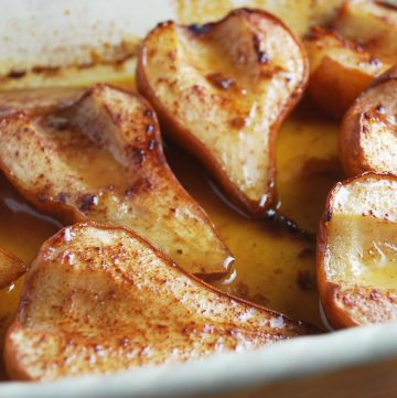roasted pear halves in a baking dish