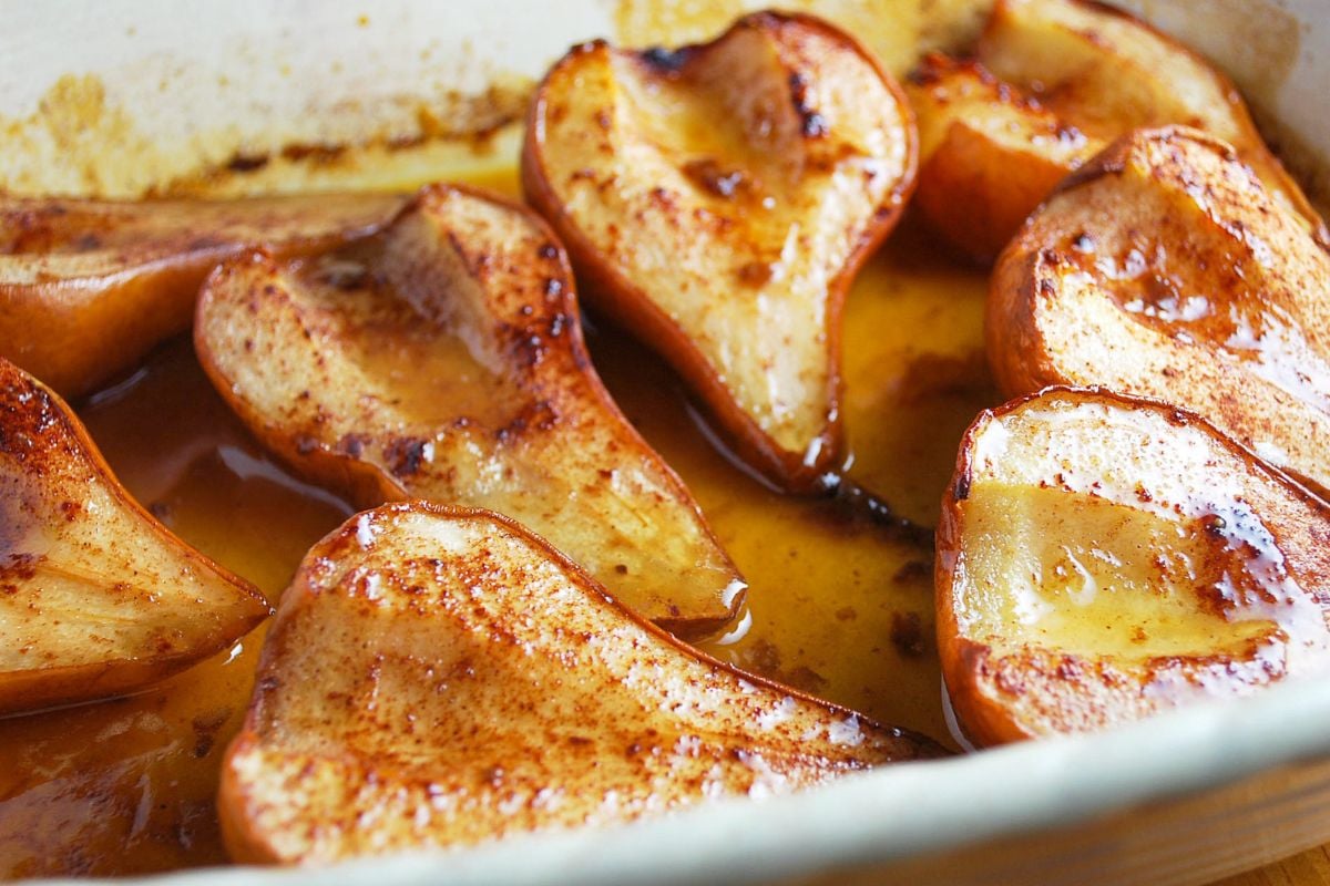 roasted pears in a baking dish with a maple glaze