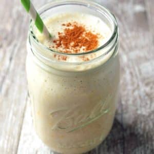 banana smoothie topped with cinnamon in a glass