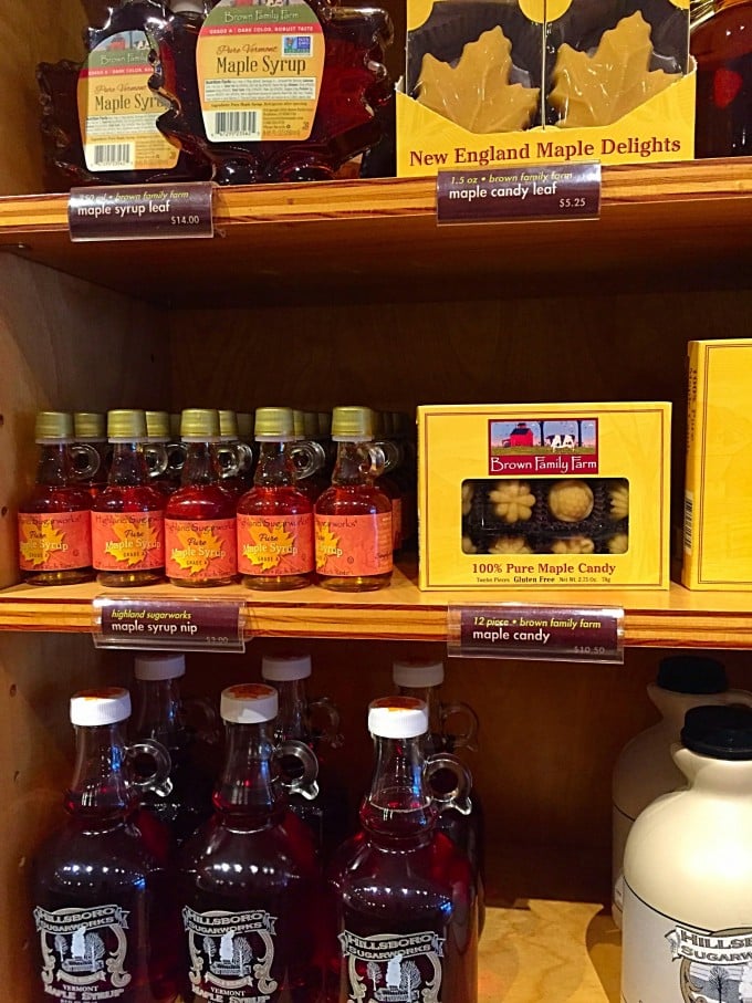 Bottles of maple syrup on a shelf in a Vermont store