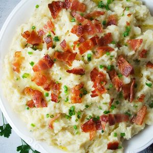 close up photo of a bowl of loaded mashed potatoes
